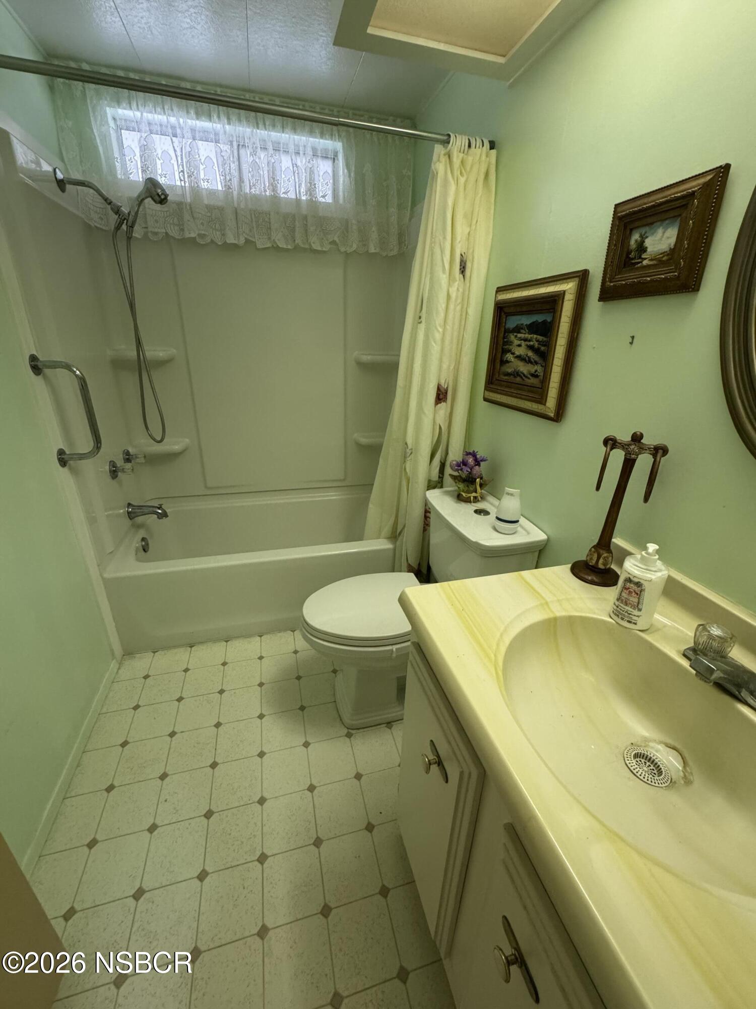 3210 Santa Maria Way, Unit 173 Santa Maria, CA 93455 - Photo 11 of 24 a bathroom with a sink a toilet and shower