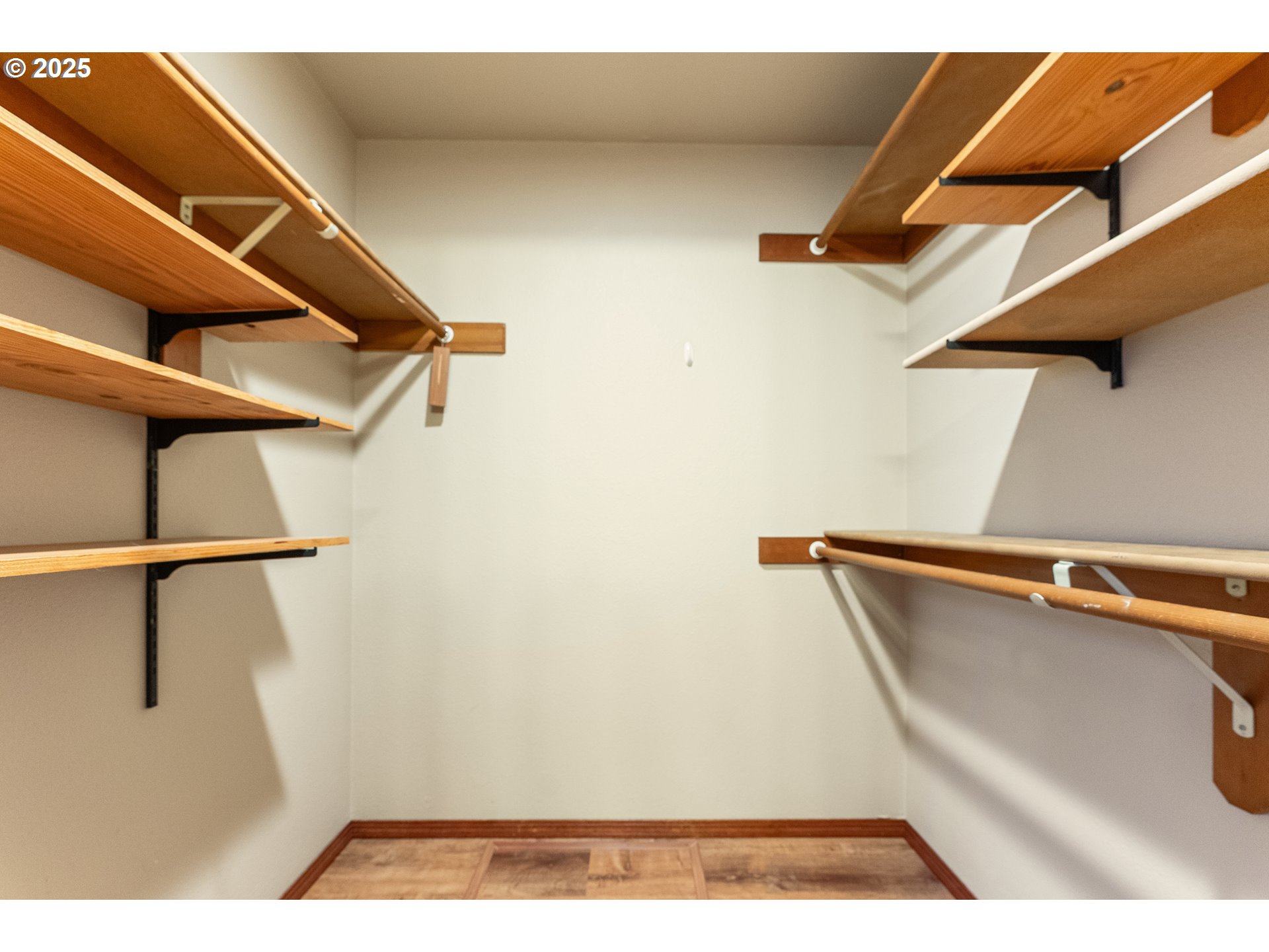 2315 Northeast 156th Place Portland, OR 97230 - Photo 16 of 25 a view of walk in closet with clothes and shoes