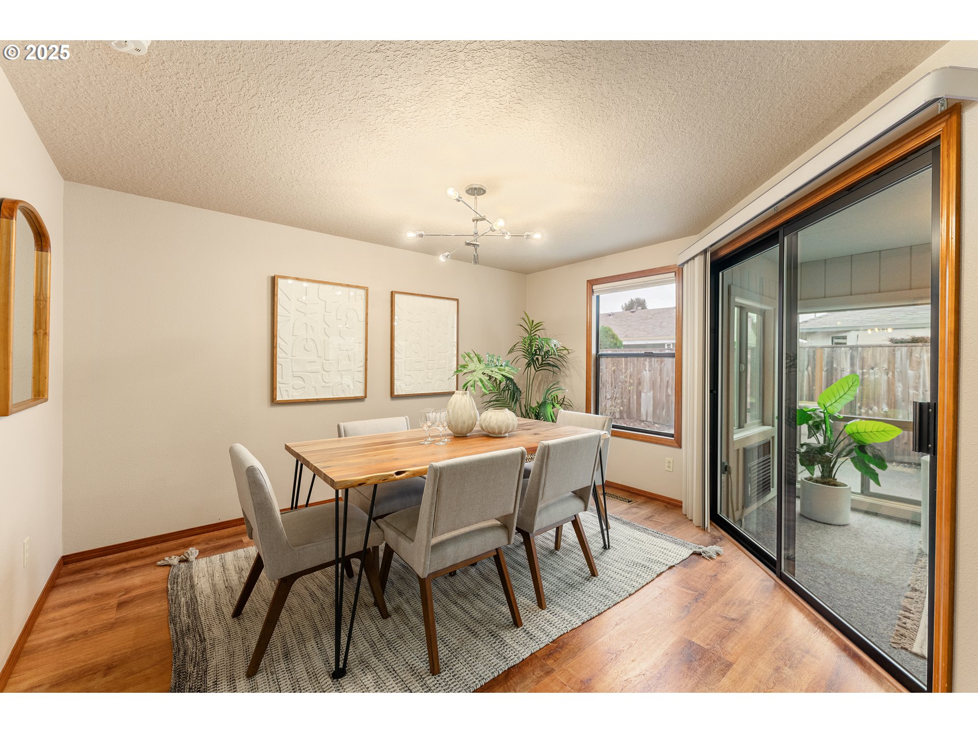 2315 Northeast 156th Place Portland, OR 97230 - Photo 5 of 25 a view of a dining room with furniture window and wooden floor