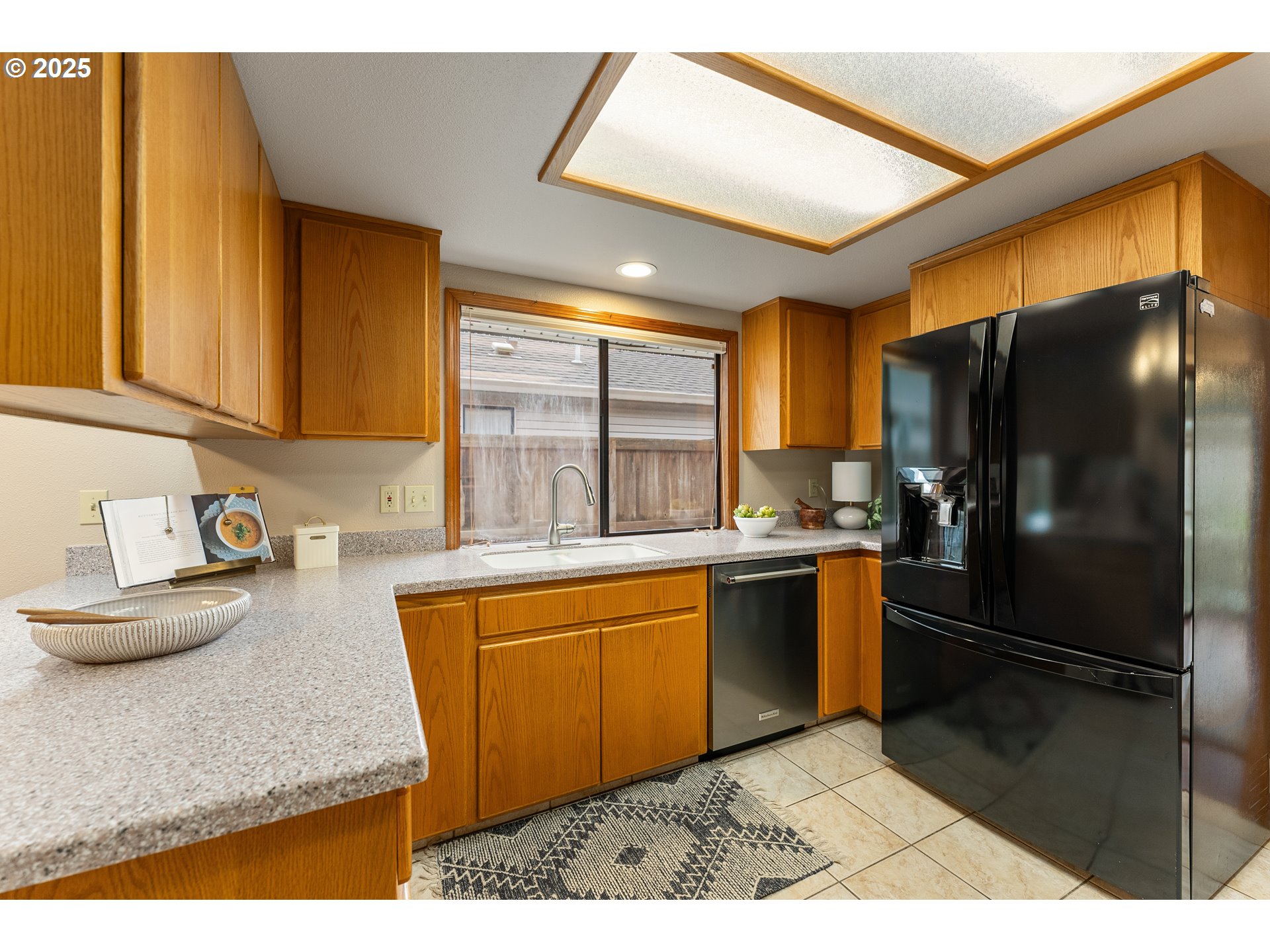 2315 Northeast 156th Place Portland, OR 97230 - Photo 8 of 25 a kitchen with stainless steel appliances granite countertop a refrigerator and a sink