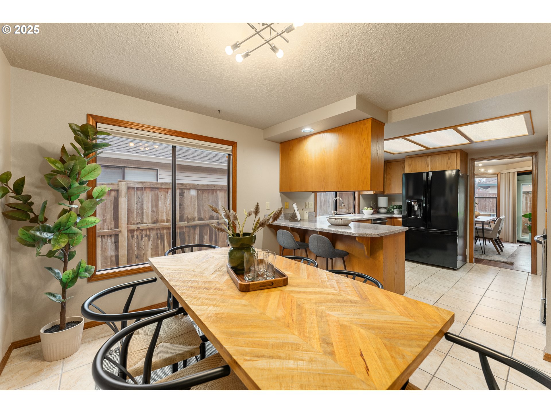 2315 Northeast 156th Place Portland, OR 97230 - Photo 10 of 25 a room with table chairs and a dining table