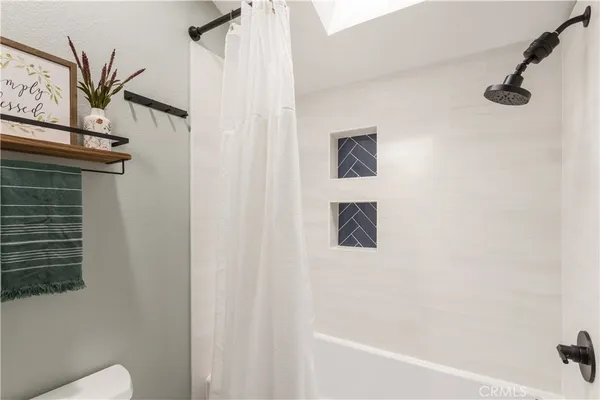 a bathroom with a shower curtain