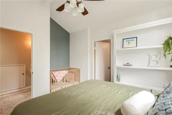 a bedroom with a bed and cabinets