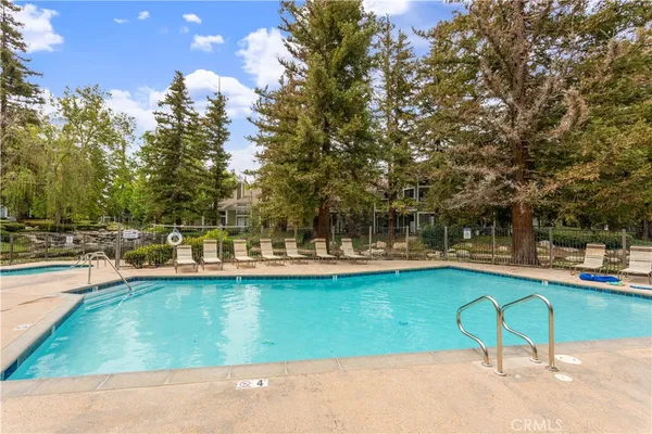 a view of a swimming pool with a patio