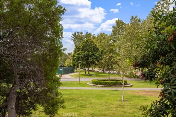 a view of backyard with swimming pool