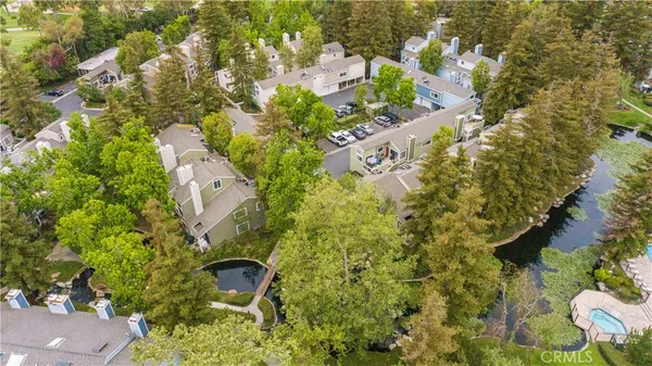 an aerial view of a house a yard and green space