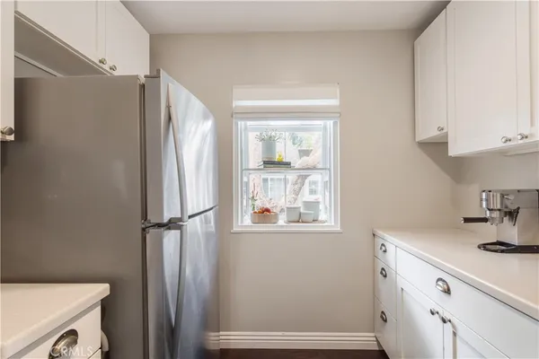 a bathroom with a sink a toilet and a window