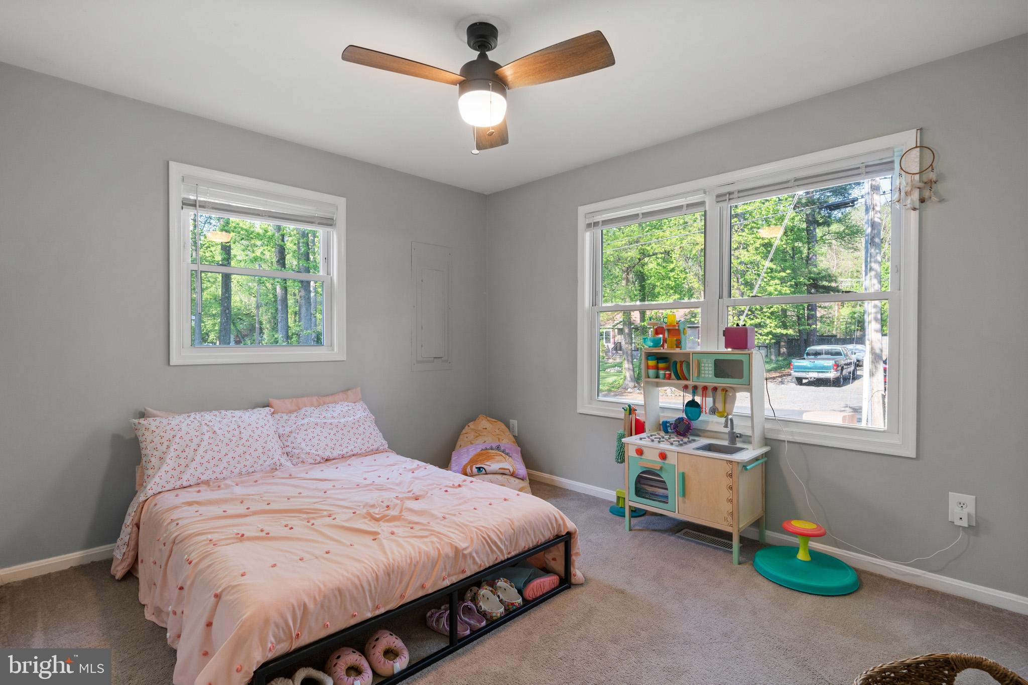11619 Big Sandy Run Road Lusby, MD 20657 - Photo 17 of 31 a bedroom with a bed and a window