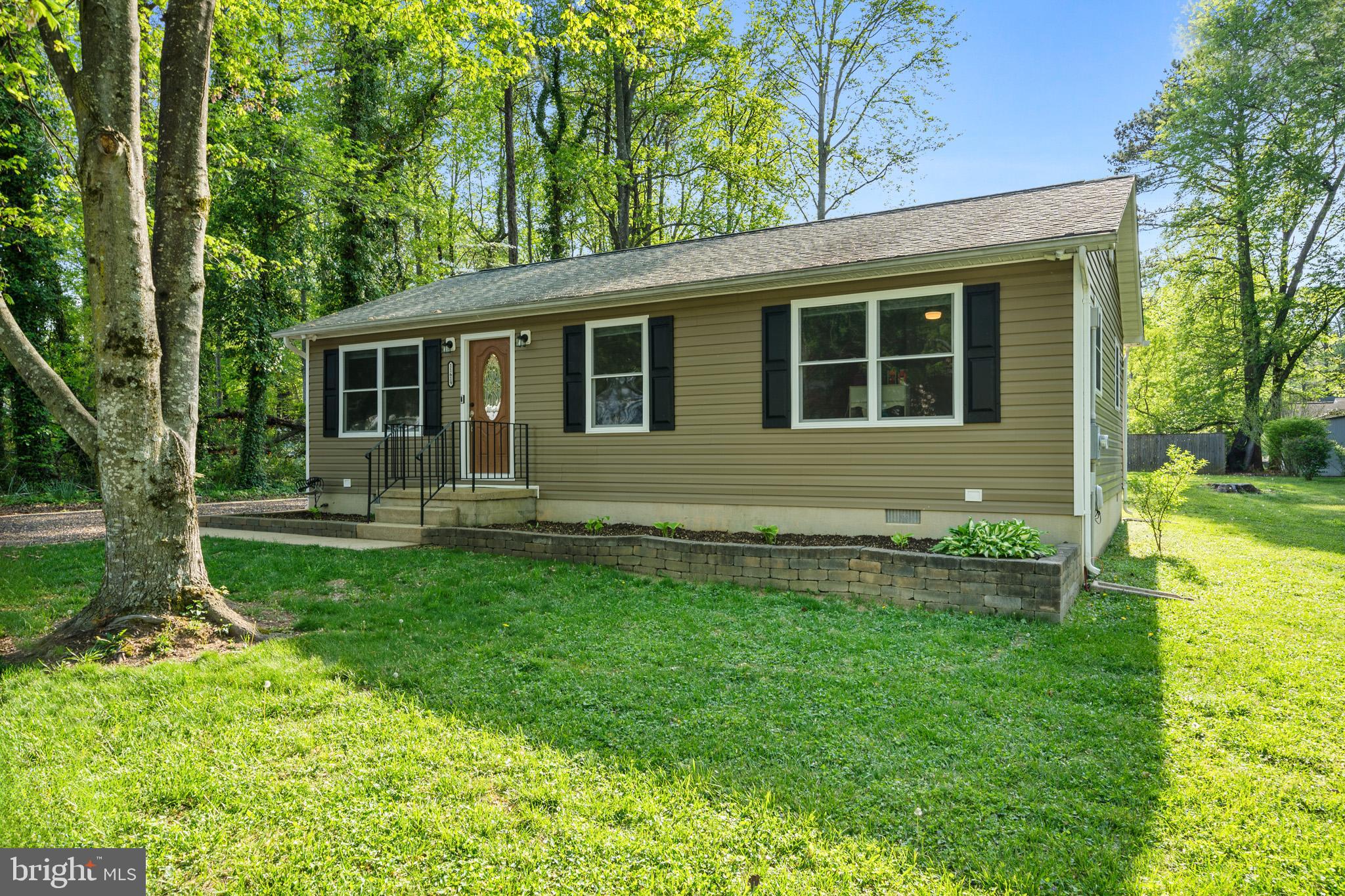 11619 Big Sandy Run Road Lusby, MD 20657 - Photo 31 of 31 a front view of house with yard and green space
