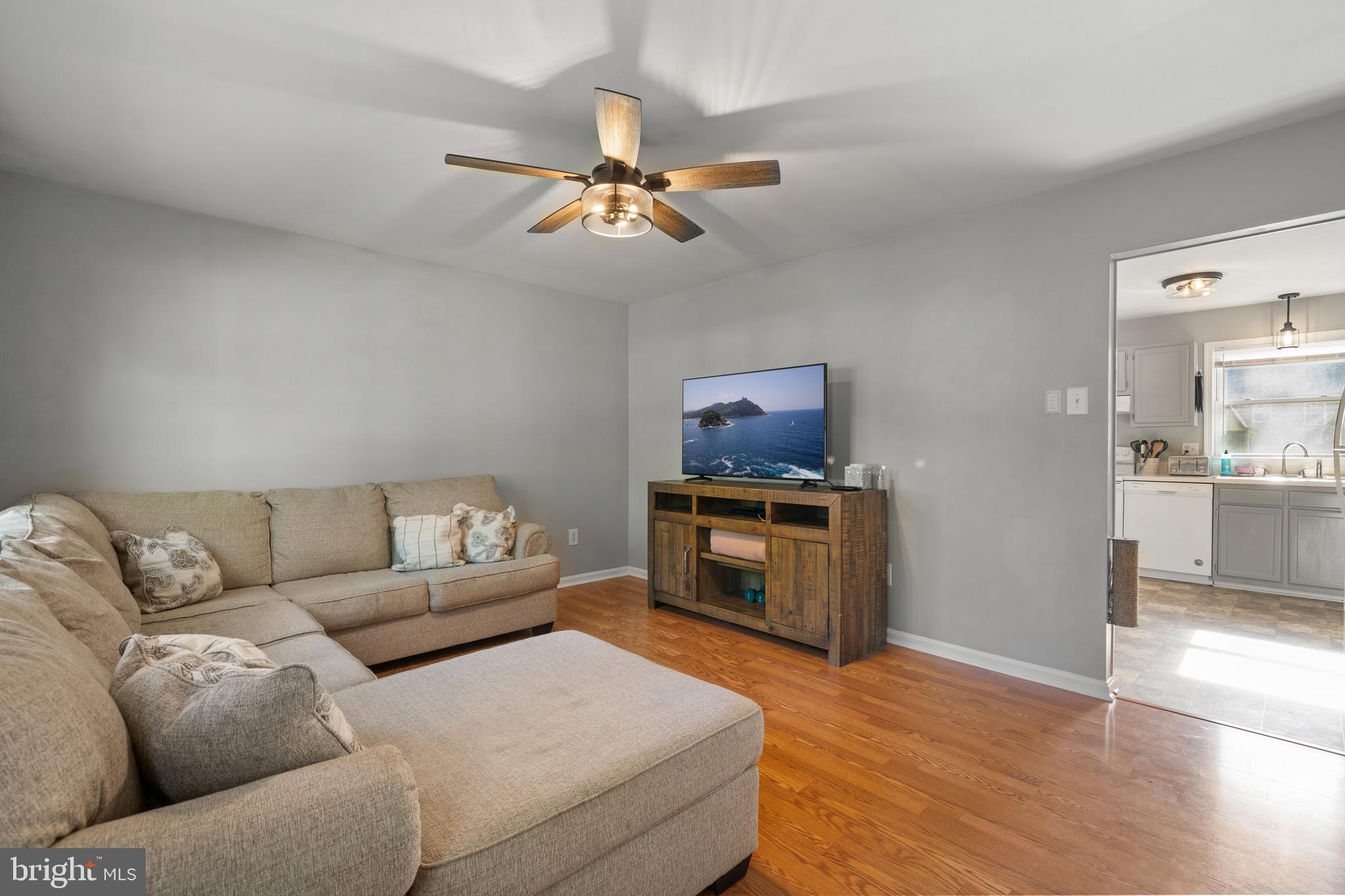 11619 Big Sandy Run Road Lusby, MD 20657 - Photo 4 of 31 a living room with furniture and a flat screen tv