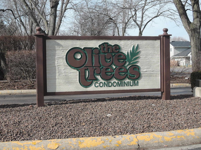 124 East Bailey Road, Unit L Naperville, IL 60565 - Photo 19 of 19 a wooden door with sign board