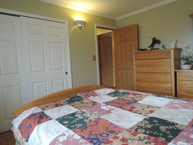 124 East Bailey Road, Unit L Naperville, IL 60565 - Photo 10 of 19 a bedroom with a bed and cabinets