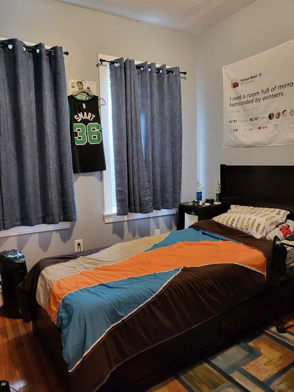 12 Watts Street, Unit 1 Chelsea, MA 02150 - Photo 13 of 29 a bedroom with a bed and a dresser