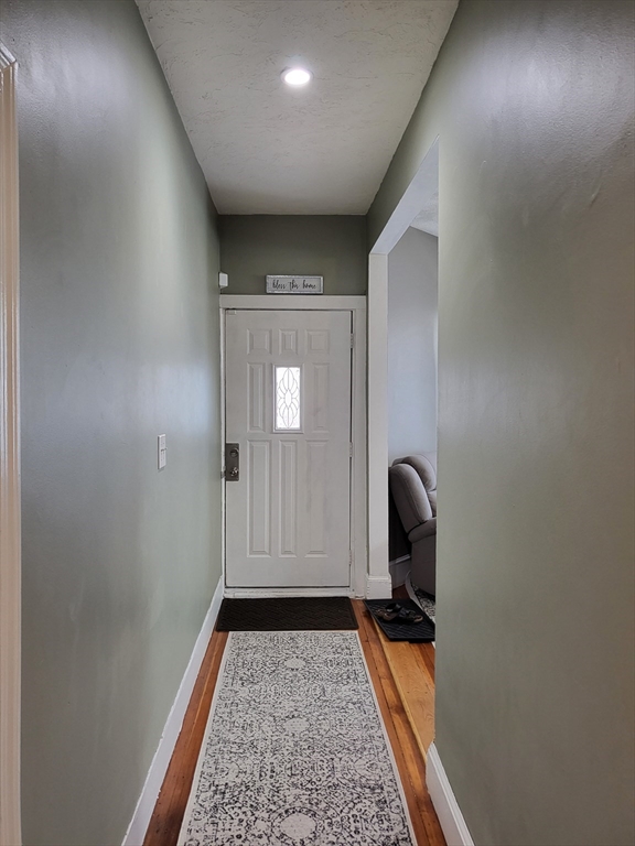 12 Watts Street, Unit 1 Chelsea, MA 02150 - Photo 7 of 29 a view of a livingroom with couch and a potted plant