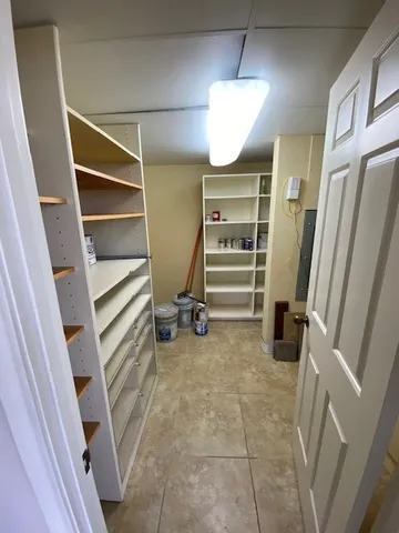 a view of an empty room with a fireplace