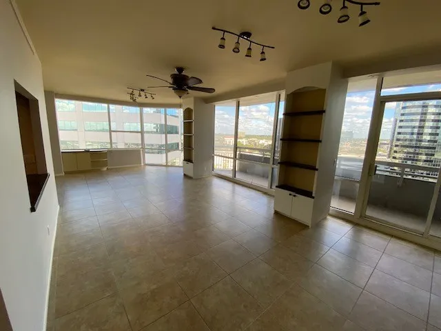 a view of an empty room with a window