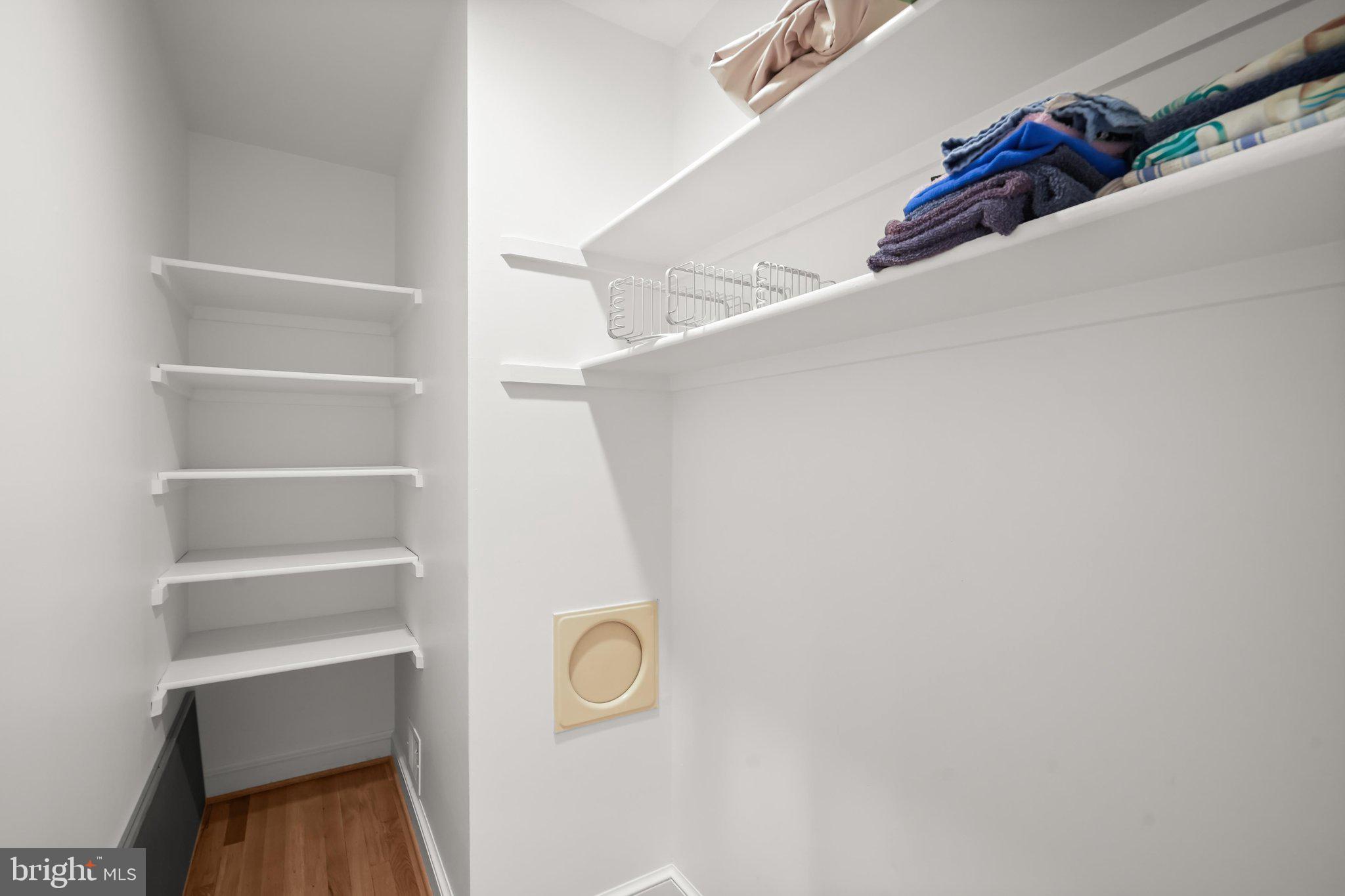 9809 Hall Road Potomac, MD 20854 - Photo 35 of 60 a view of walk in closet with empty racks