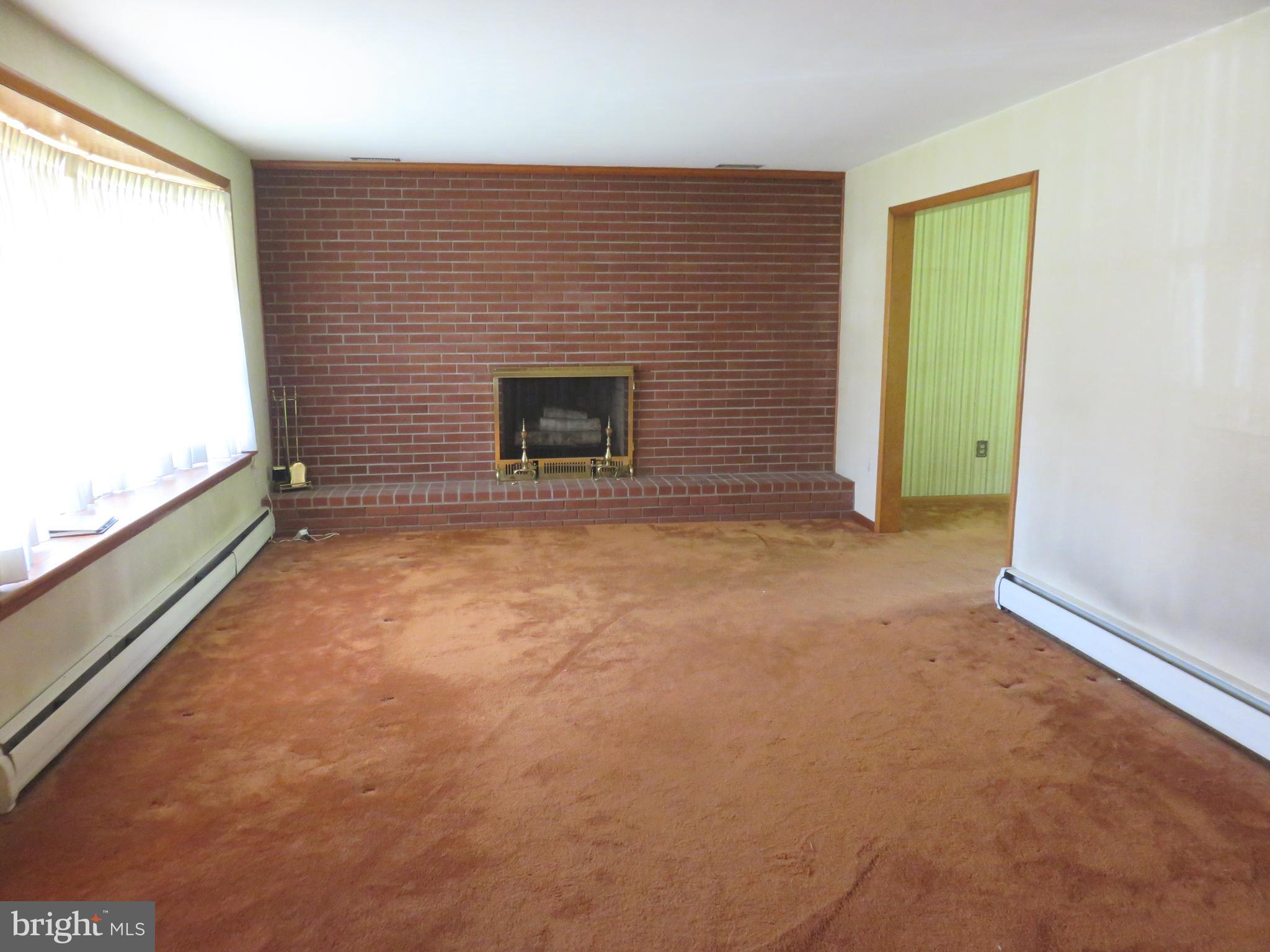 9819 Fox Hill Road Perry Hall, MD 21128 - Photo 4 of 21 LIVING ROOM W/WOOD BURNING FIREPLACE