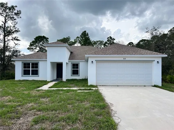 a view of house with yard