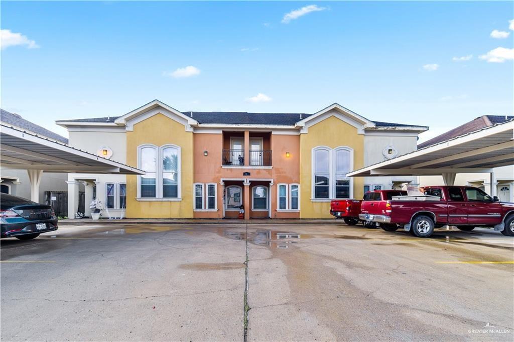 1309 West Fig Avenue, Unit C Pharr, TX 78577 - Photo 1 of 20 a front view of a house with a garden and parking