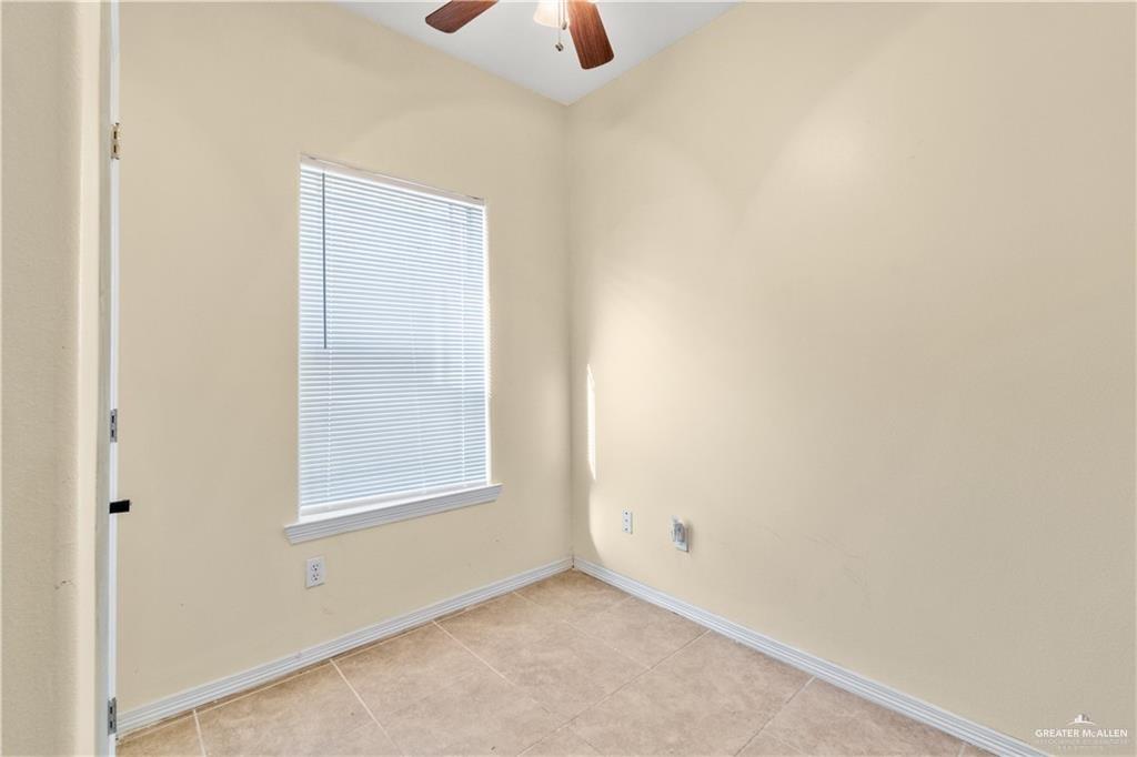 1309 West Fig Avenue, Unit C Pharr, TX 78577 - Photo 12 of 20 an empty room with a window