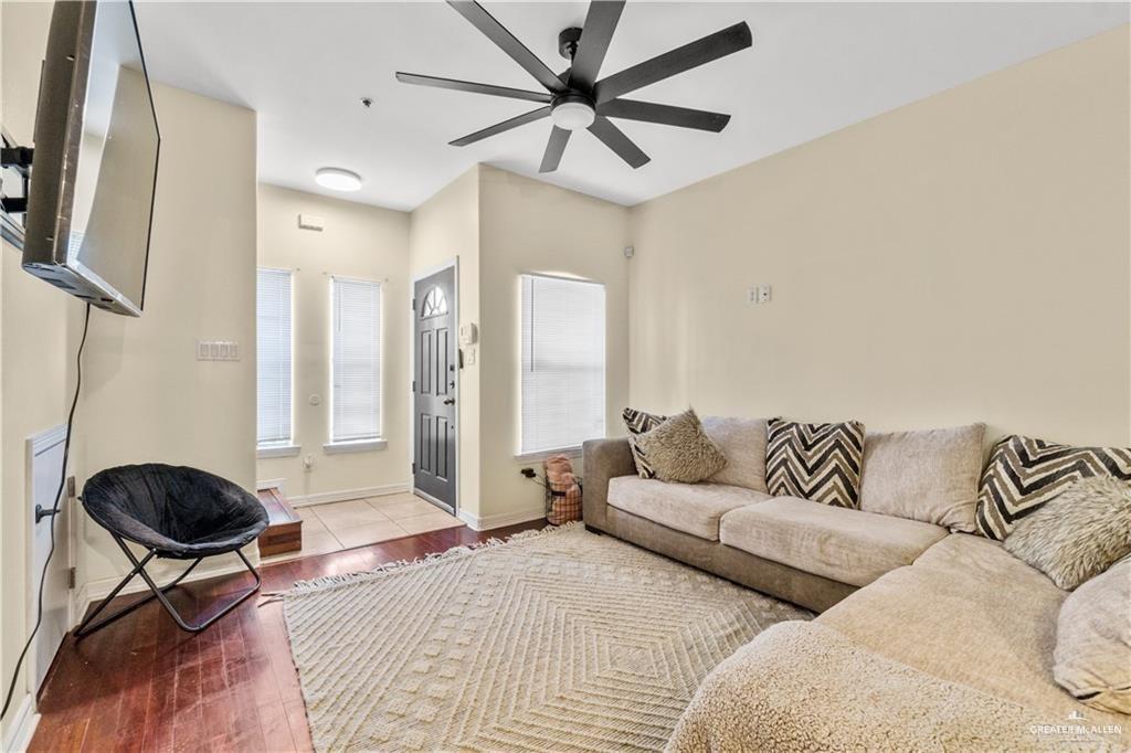 1309 West Fig Avenue, Unit C Pharr, TX 78577 - Photo 6 of 20 a living room with furniture and a chandelier