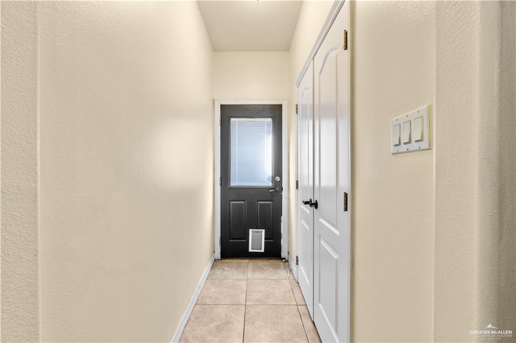 1309 West Fig Avenue, Unit C Pharr, TX 78577 - Photo 10 of 20 a view of a hallway with wooden shelves