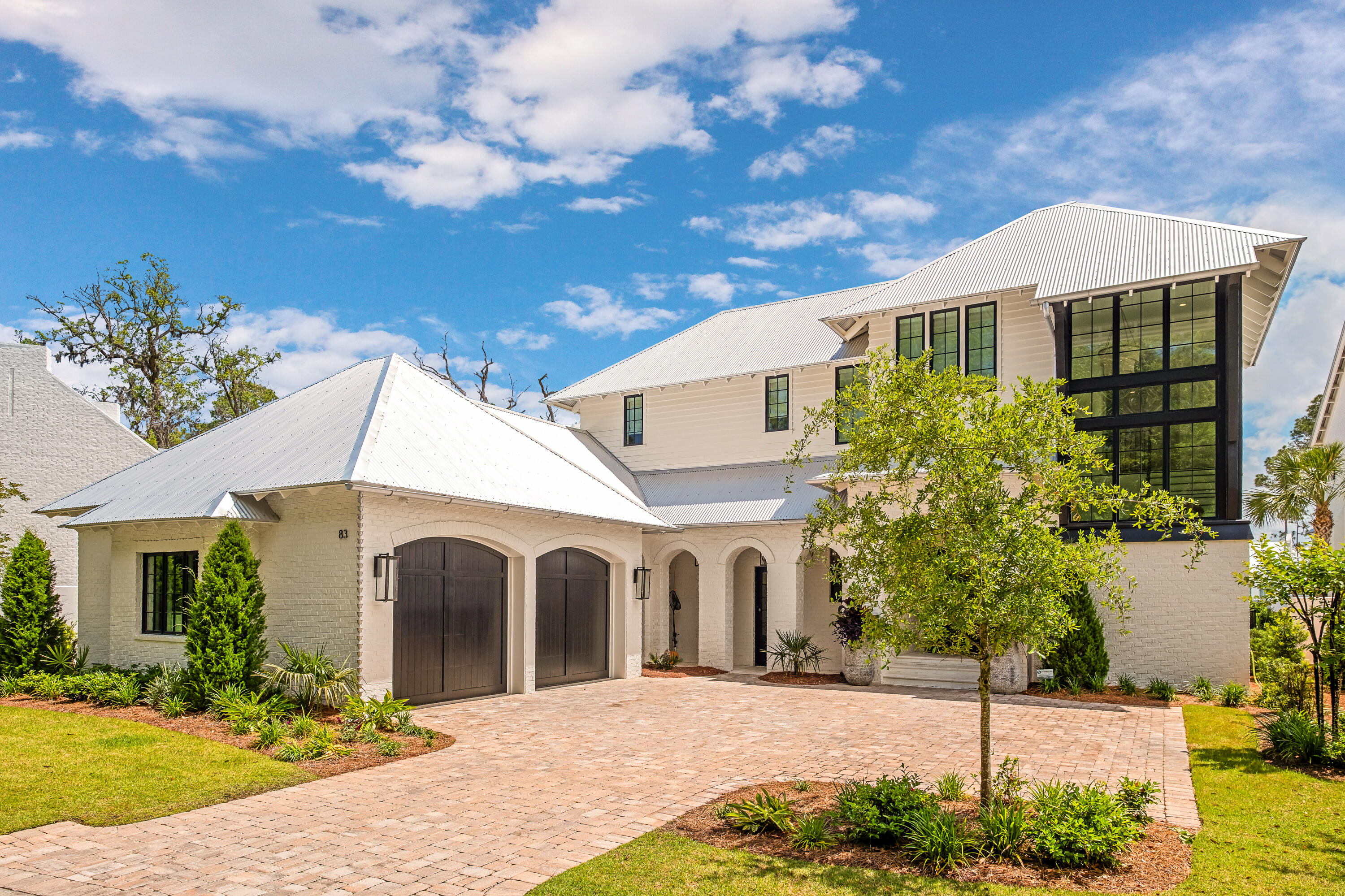 83 Tyler Drive Santa Rosa Beach, FL 32459 - Photo 4 of 68 a front view of a house with a yard