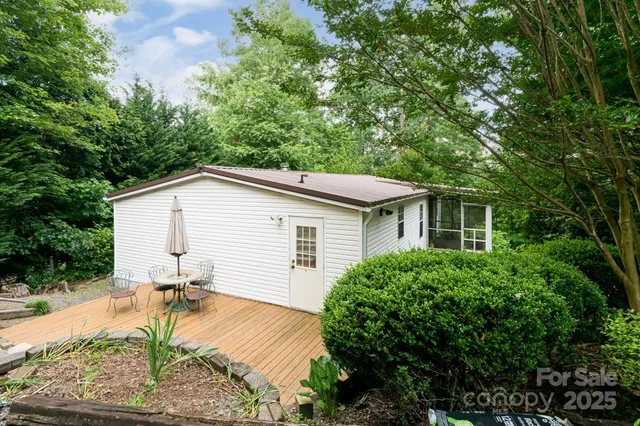 a view of a house with pool and sitting area