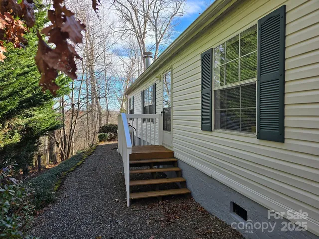 a view of a backyard with stairs and a garden