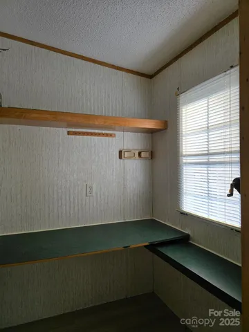 a kitchen with a sink and a window