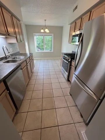 a view of a livingroom with furniture and staircase