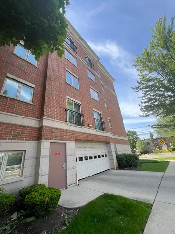 a view of a building with a yard