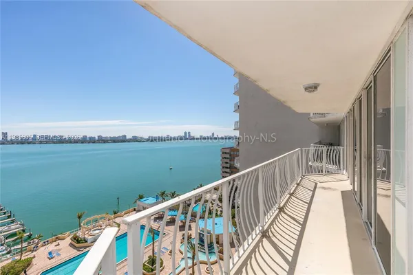 a view of balcony with furniture