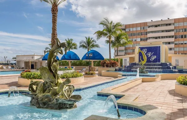 a building outdoor space with patio furniture and potted plants