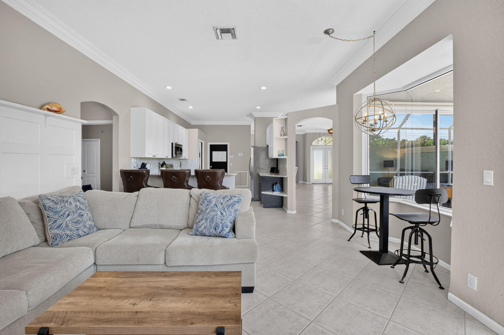 1365 East Barwick Ranch Circle Delray Beach, FL 33445 - Photo 39 of 77 a living room with furniture and view of kitchen