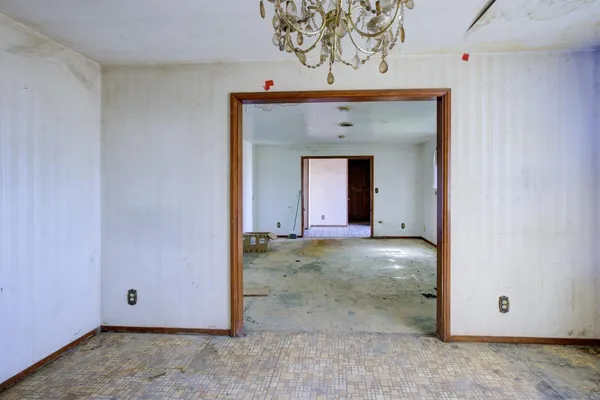 a room with a table and chairs