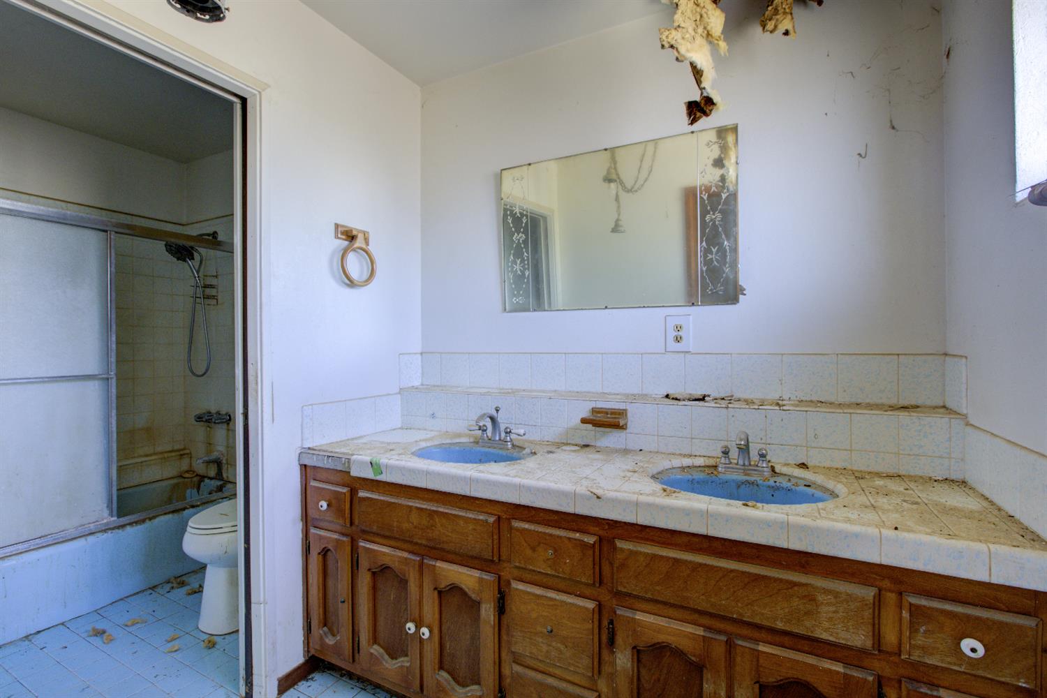873 Loquat Avenue Patterson, CA 95363 - Photo 23 of 35 a bathroom with a granite countertop sink mirror and toilet