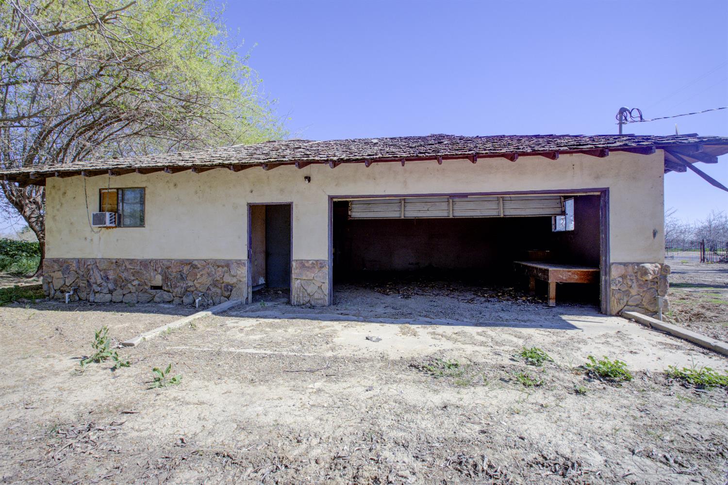 873 Loquat Avenue Patterson, CA 95363 - Photo 4 of 35 a front view of a house with a yard