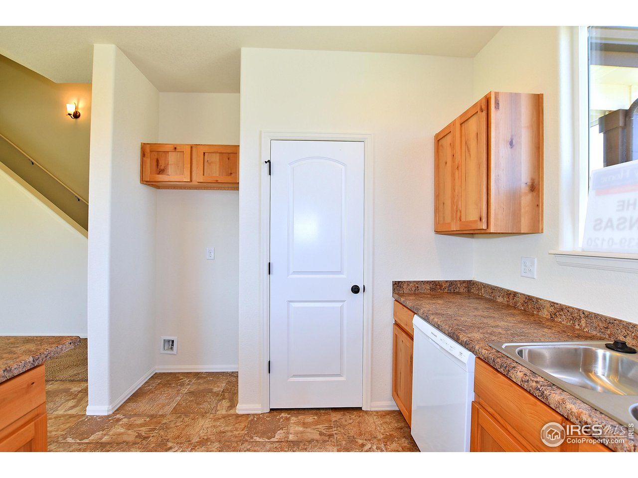 2310 Sublime Drive Windsor, CO 80550 - Photo 14 of 37 a view of a kitchen from the hallway