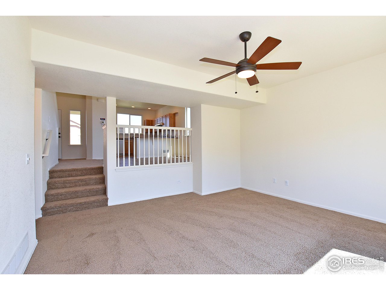 2310 Sublime Drive Windsor, CO 80550 - Photo 17 of 37 a view of an empty room with a window
