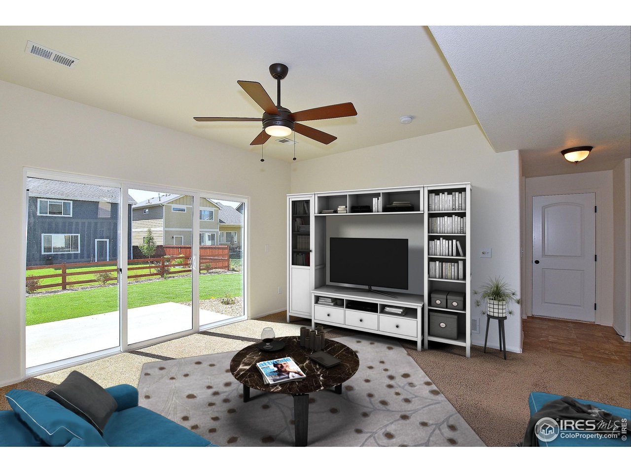 2310 Sublime Drive Windsor, CO 80550 - Photo 2 of 37 a living room with furniture and a flat screen tv