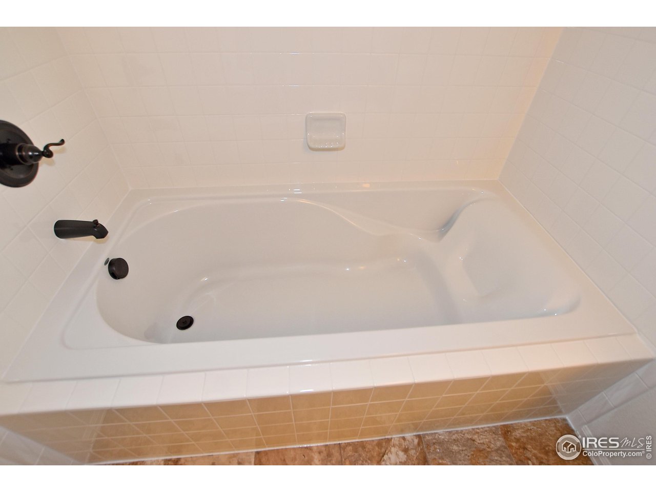 2310 Sublime Drive Windsor, CO 80550 - Photo 24 of 37 a bathroom with a tub