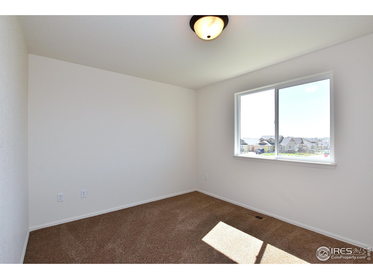 2310 Sublime Drive Windsor, CO 80550 - Photo 29 of 37 an empty room with a window