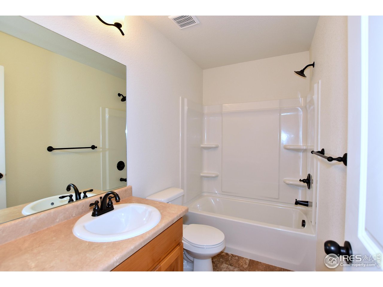 2310 Sublime Drive Windsor, CO 80550 - Photo 32 of 37 a bathroom with a sink a toilet and shower