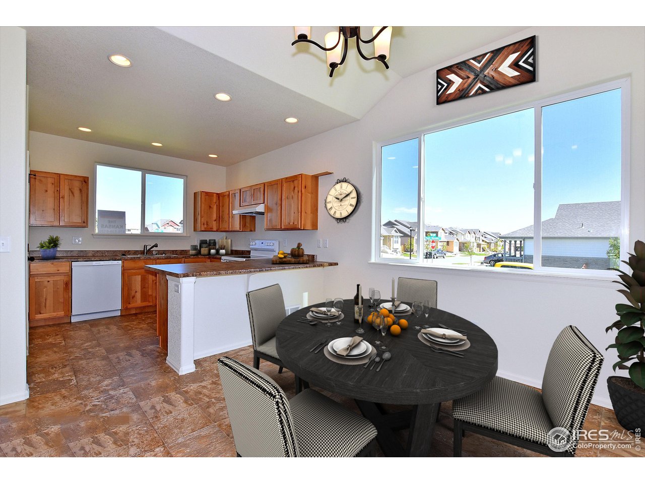 2310 Sublime Drive Windsor, CO 80550 - Photo 5 of 37 a kitchen with a table and chairs in it