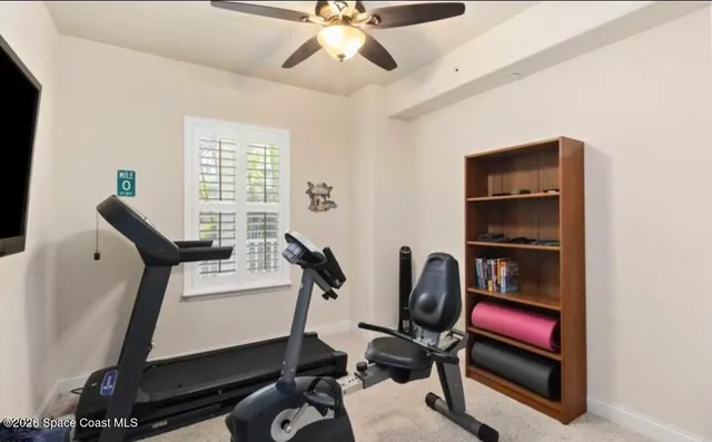 a bathroom with a granite countertop sink mirror and a bathtub