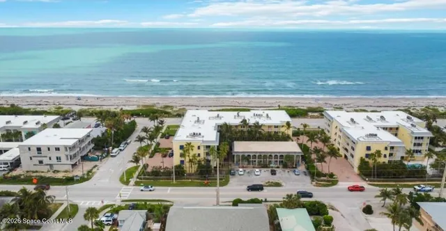 a view of parking area with an ocean view