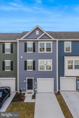 a front view of a house with yard