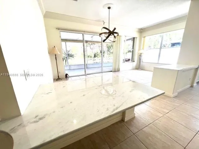 a view of a kitchen with a sink and cabinets